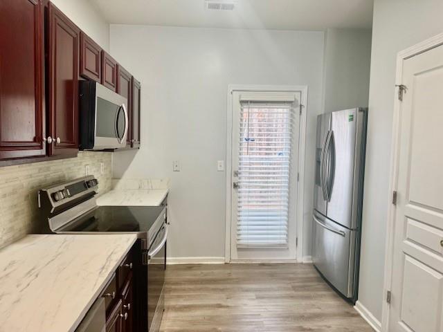 4433 Watson Ridge Drive Stone Mountain, GA 30083 - Photo 14 of 48 a kitchen with a refrigerator sink and cabinets