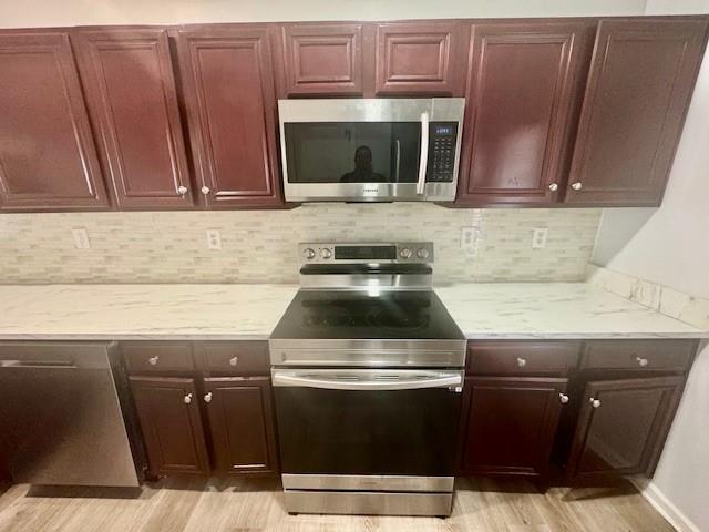 4433 Watson Ridge Drive Stone Mountain, GA 30083 - Photo 16 of 48 a stove top oven sitting inside of a kitchen