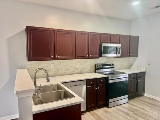 4433 Watson Ridge Drive Stone Mountain, GA 30083 - Photo 19 of 48 a kitchen with a sink cabinets and stainless steel appliances