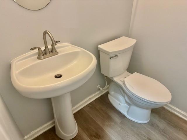 4433 Watson Ridge Drive Stone Mountain, GA 30083 - Photo 22 of 48 a bathroom with a toilet sink and mirror