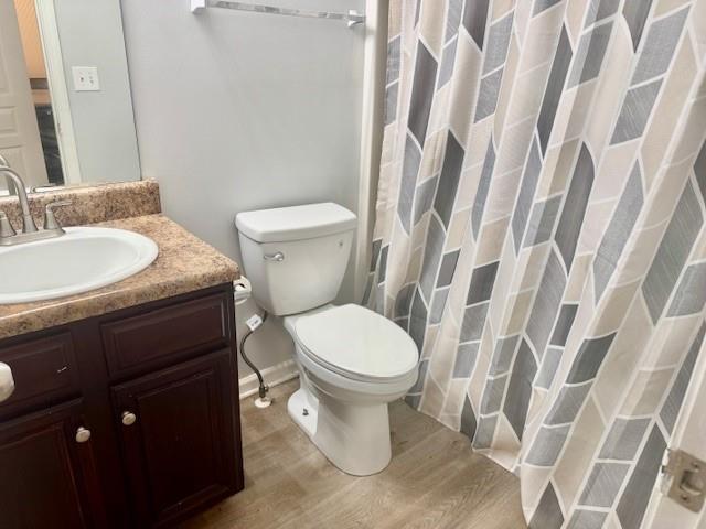 4433 Watson Ridge Drive Stone Mountain, GA 30083 - Photo 34 of 48 a white toilet sitting next to a bathroom sink