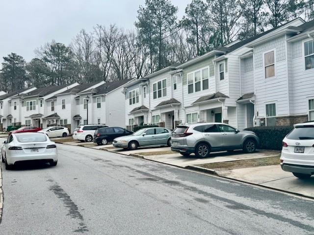 4433 Watson Ridge Drive Stone Mountain, GA 30083 - Photo 4 of 48 a view of a cars park in front of a house