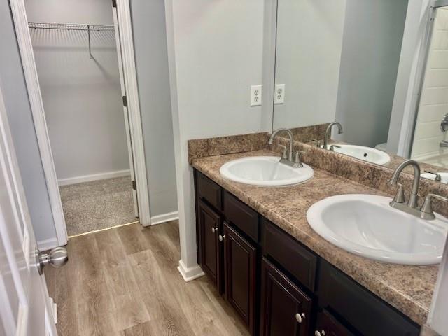 4433 Watson Ridge Drive Stone Mountain, GA 30083 - Photo 45 of 48 a bathroom with a granite countertop sink and a mirror