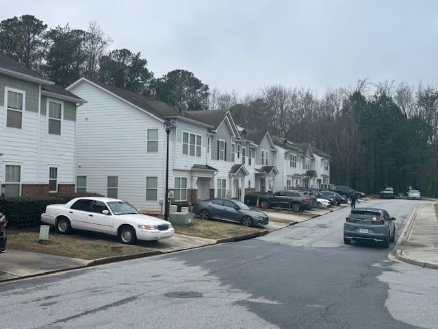 4433 Watson Ridge Drive Stone Mountain, GA 30083 - Photo 5 of 48 a view of a cars park in front of a house