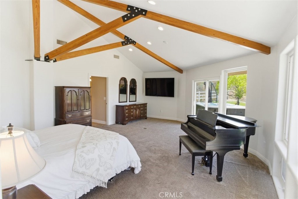 31233 Romero Canyon Road Castaic, CA 91384 - Photo 21 of 38 a living room with furniture and a flat screen tv