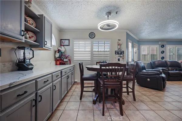 a kitchen with stainless steel appliances kitchen island granite countertop a sink and cabinets