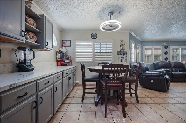 a kitchen with stainless steel appliances kitchen island granite countertop a sink and cabinets