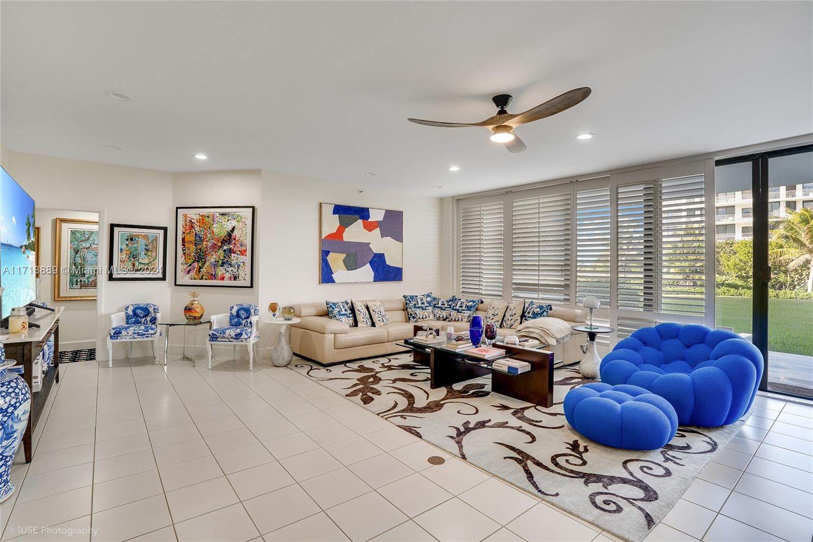 2100 South Ocean Boulevard, Unit 103N Palm Beach, FL 33480 - Photo 12 of 14 a living room with furniture and a large window