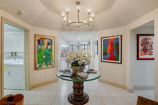 a view of a dining room with furniture wooden floor and a chandelier