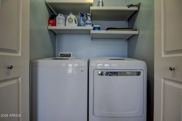 a utility room with dryer and washer