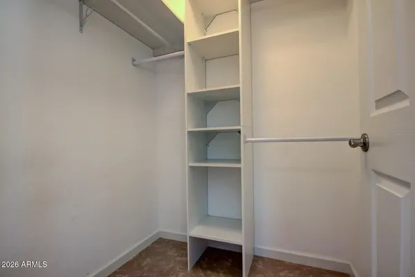 a view of an empty walk in closet