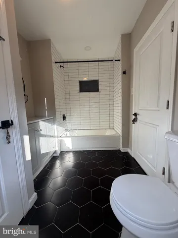 a bathroom with a sink and a shower