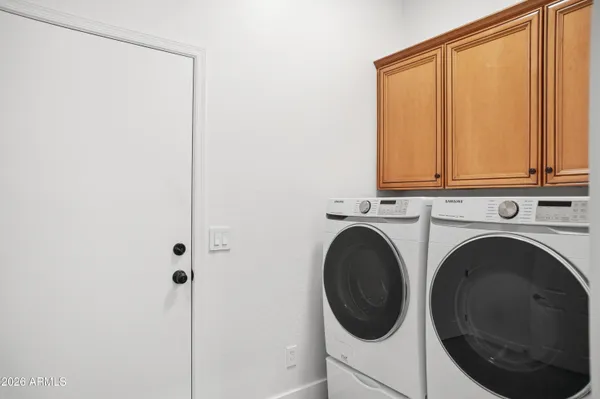 a utility room with dryer and washer