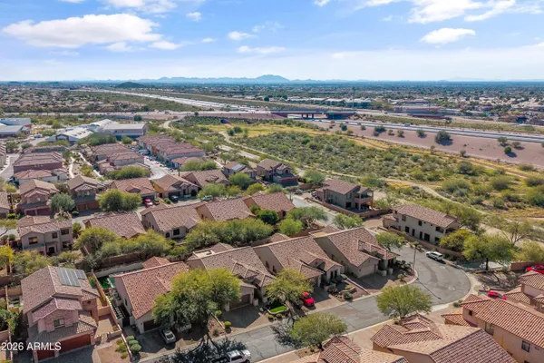 an aerial view of a city with lots of residential buildings