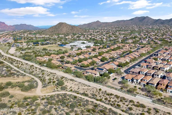 an aerial view of residential houses and outdoor space