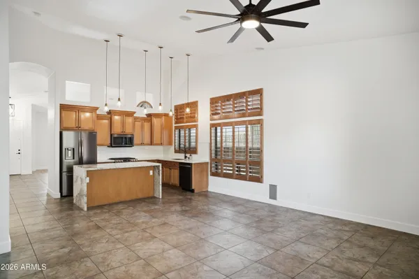 a large kitchen with cabinets and stainless steel appliances