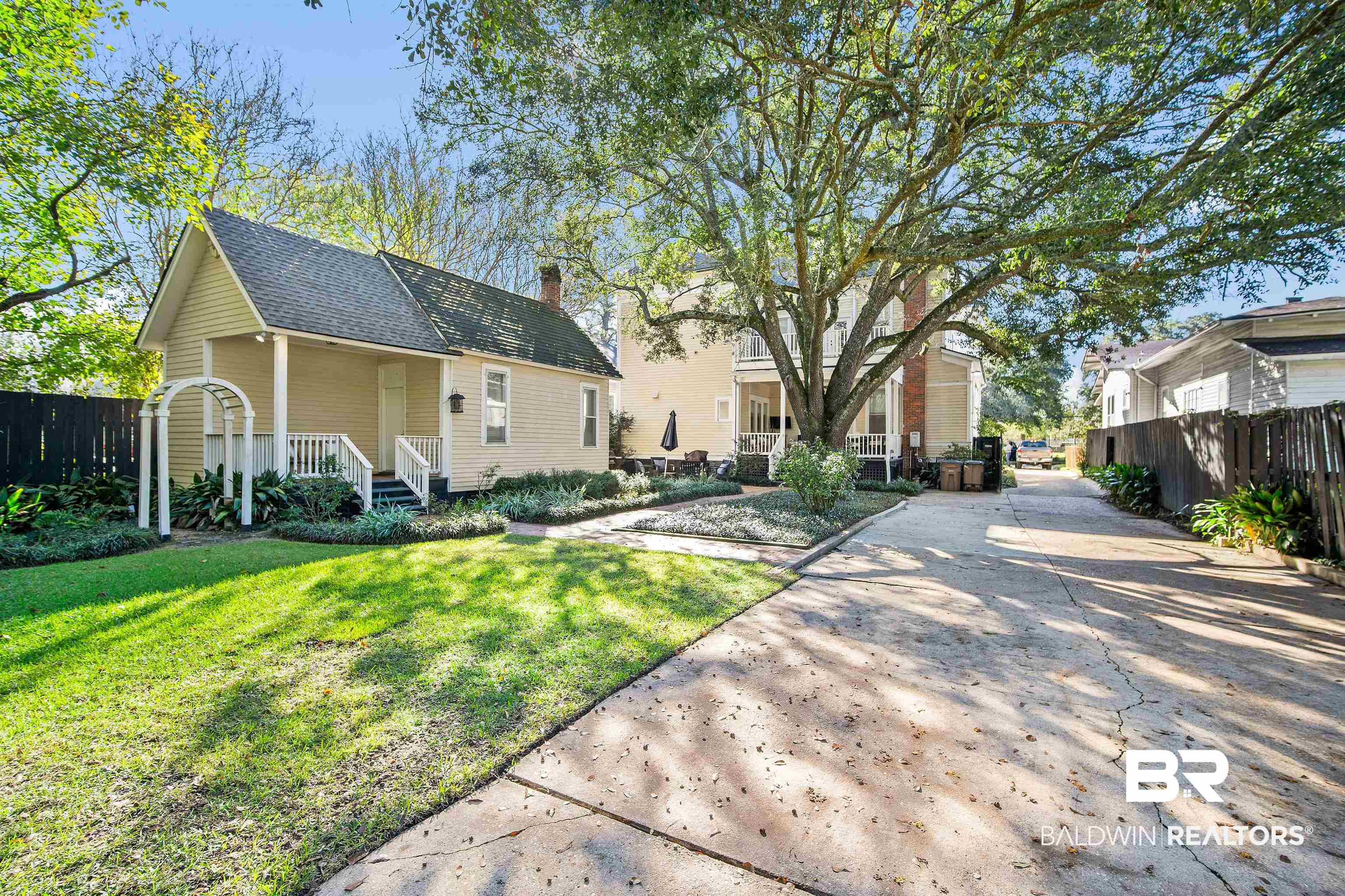 1314 Dauphin Street Mobile, AL 36604 - Photo 51 of 61 View of front of guesthouse with a front yard and covered porch