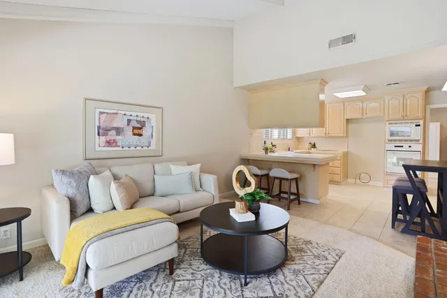 a living room with furniture and a table