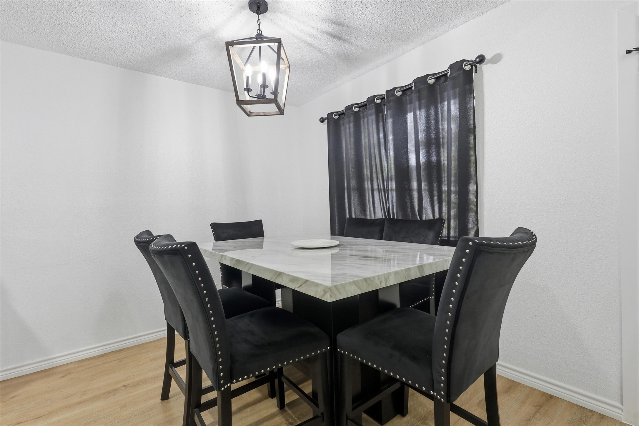 23310 Dew Wood Lane Spring, TX 77373 - Photo 12 of 24 Bright dining area with modern chandelier