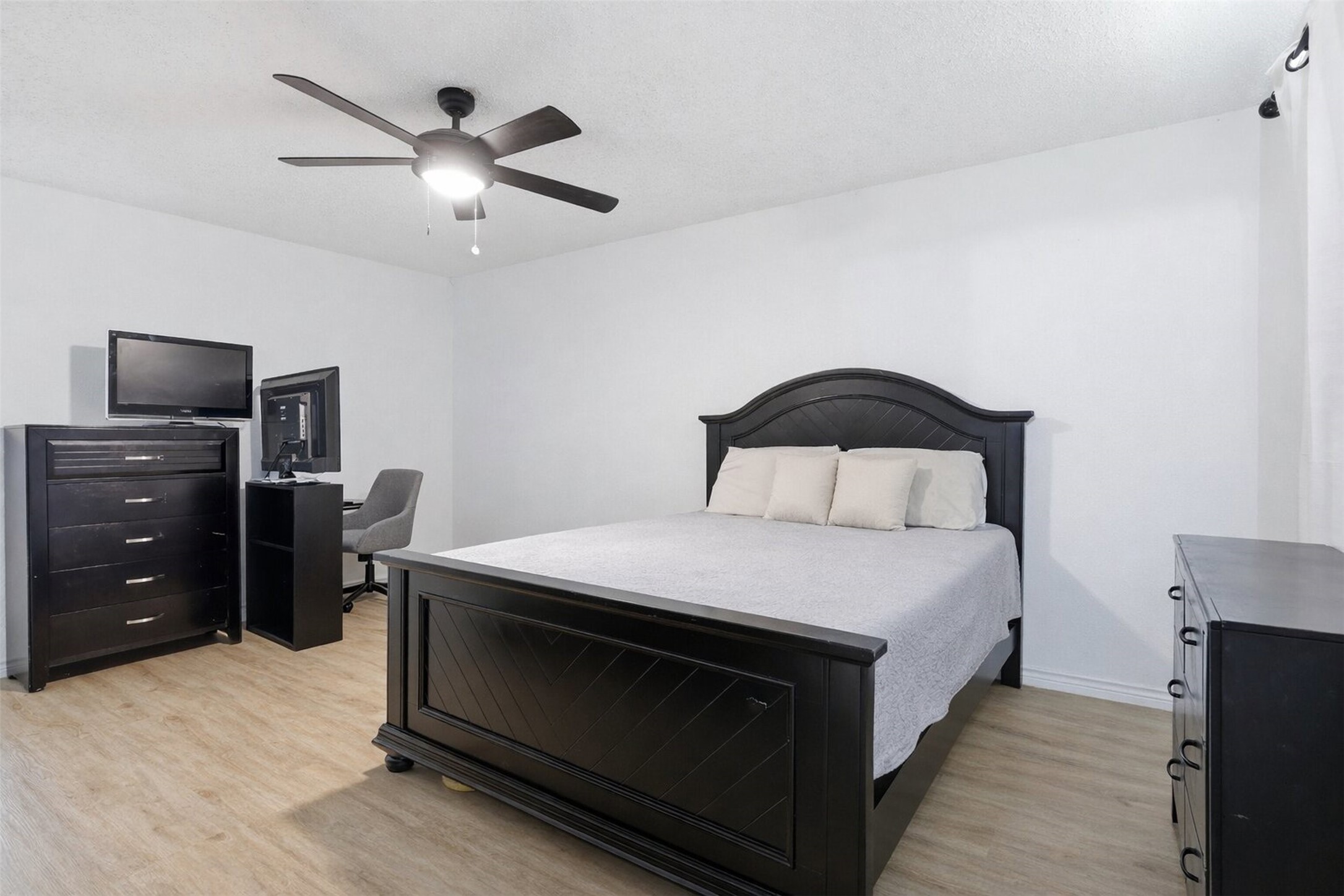 23310 Dew Wood Lane Spring, TX 77373 - Photo 14 of 24 Large primary retreat with fresh neutral paint and 2023 luxury vinyl floors