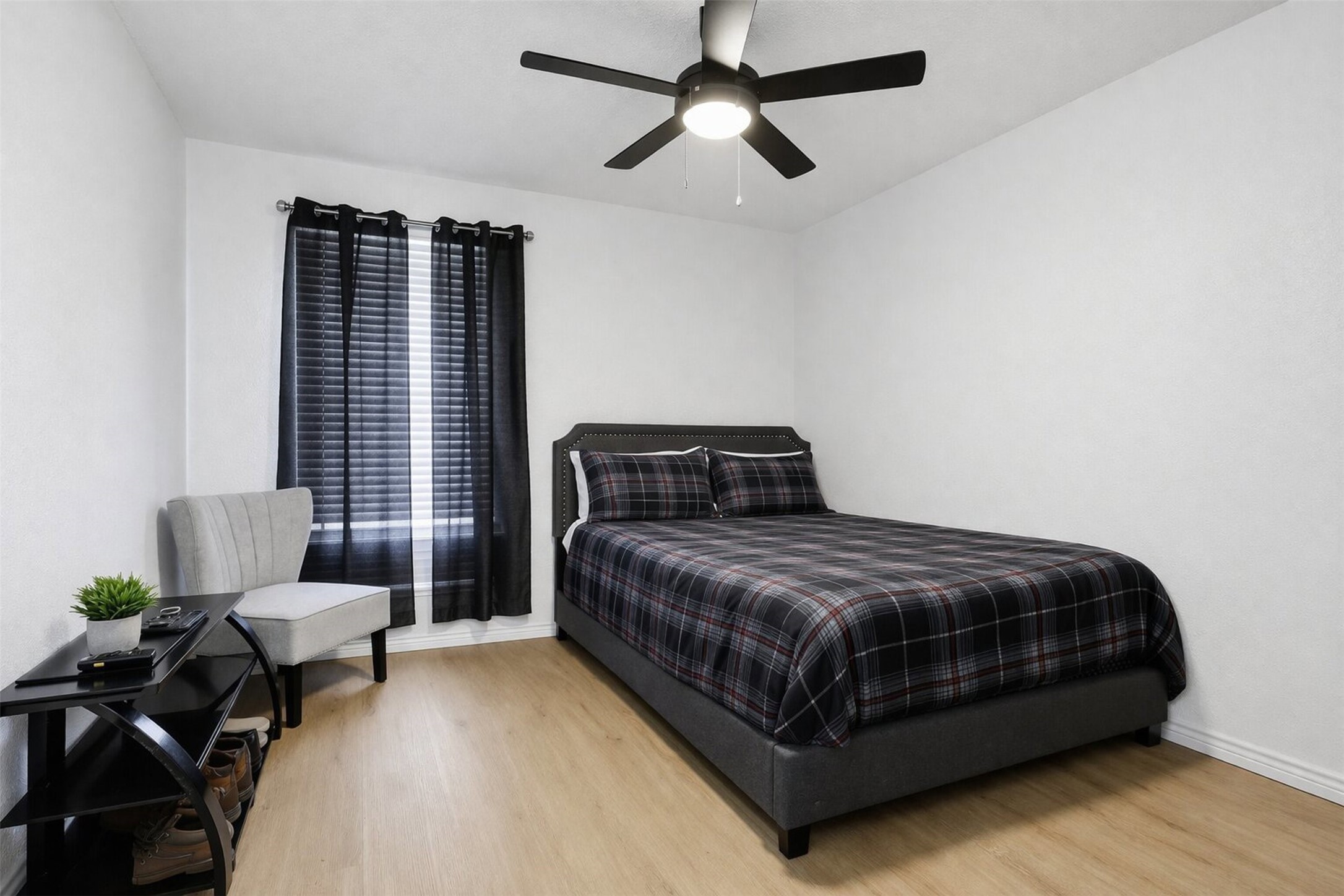 23310 Dew Wood Lane Spring, TX 77373 - Photo 15 of 24 a bedroom with a bed couch and window