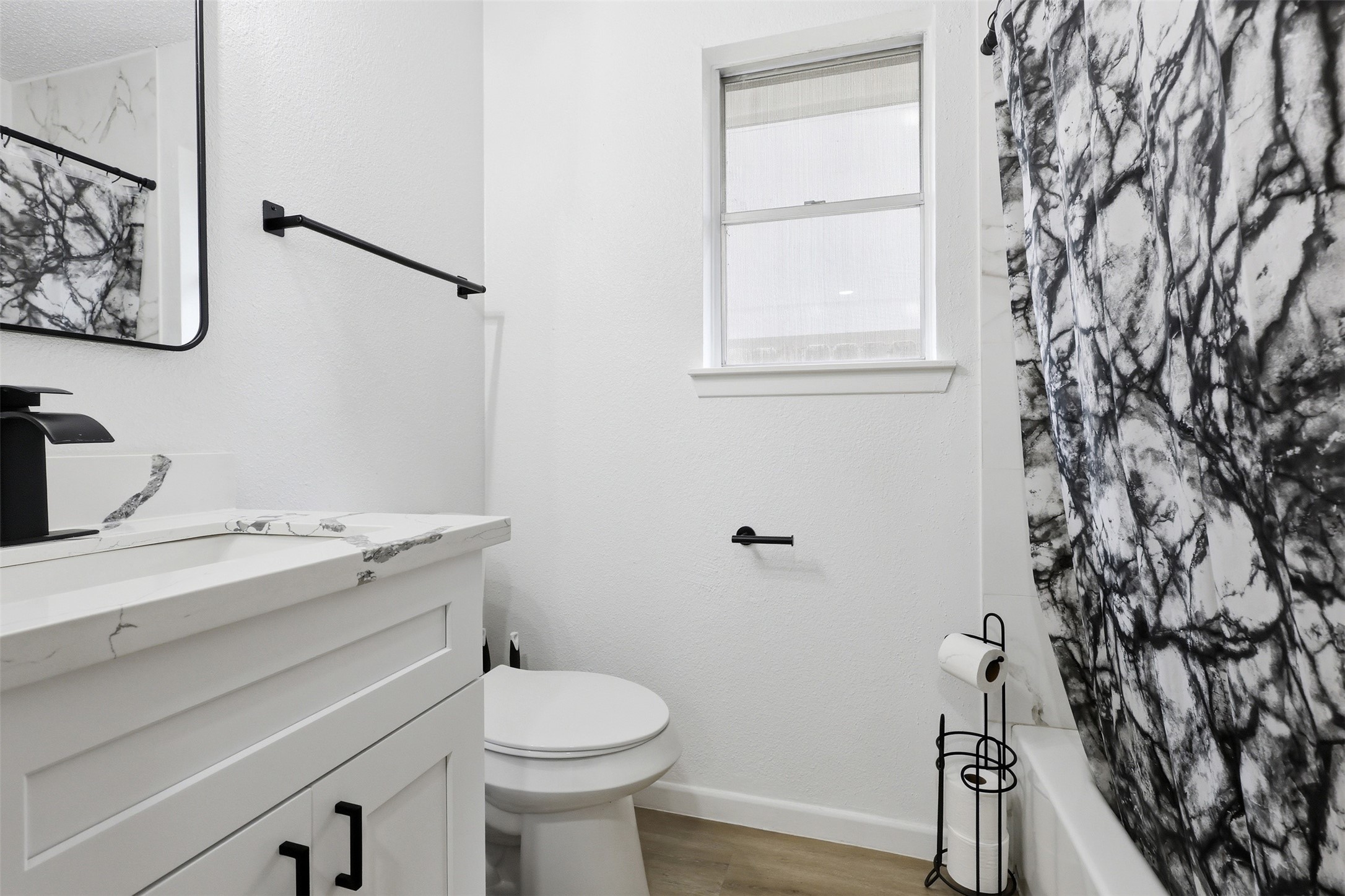 23310 Dew Wood Lane Spring, TX 77373 - Photo 21 of 24 a bathroom with a granite countertop sink toilet and a mirror