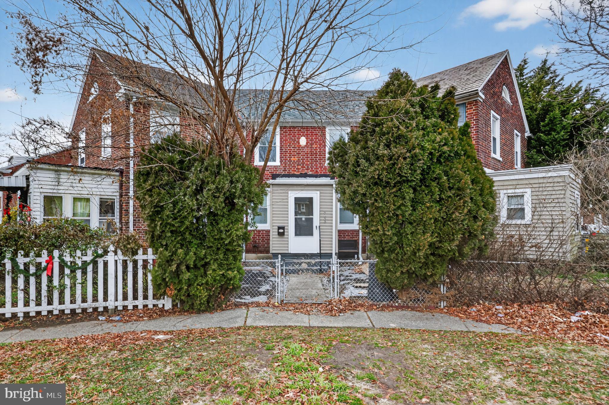 front view of a house with a yard