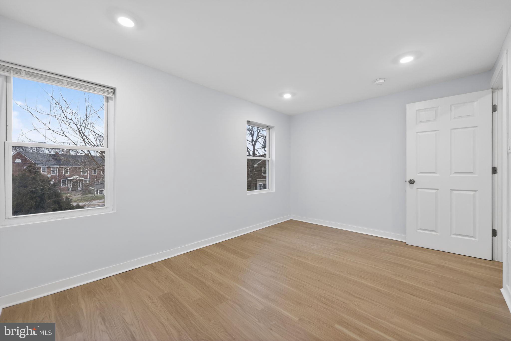 3055 Kearsarge Road Camden, NJ 08104 - Photo 12 of 26 a view of an empty room with wooden floor and a window