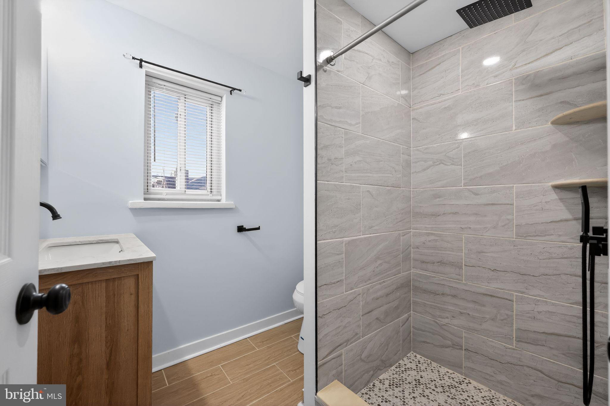 3055 Kearsarge Road Camden, NJ 08104 - Photo 18 of 26 a bathroom with a shower