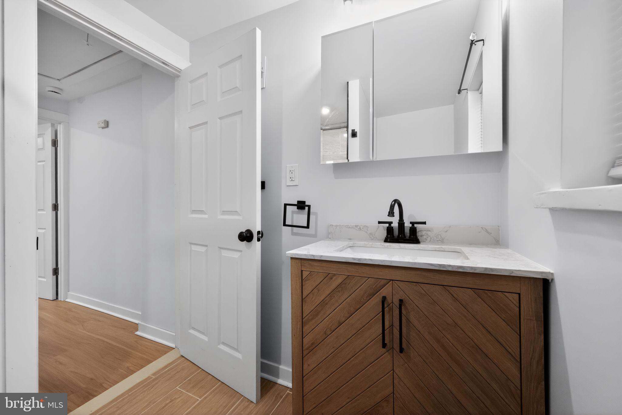 3055 Kearsarge Road Camden, NJ 08104 - Photo 19 of 26 a view of cabinets a sink and dishwasher in a kitchen