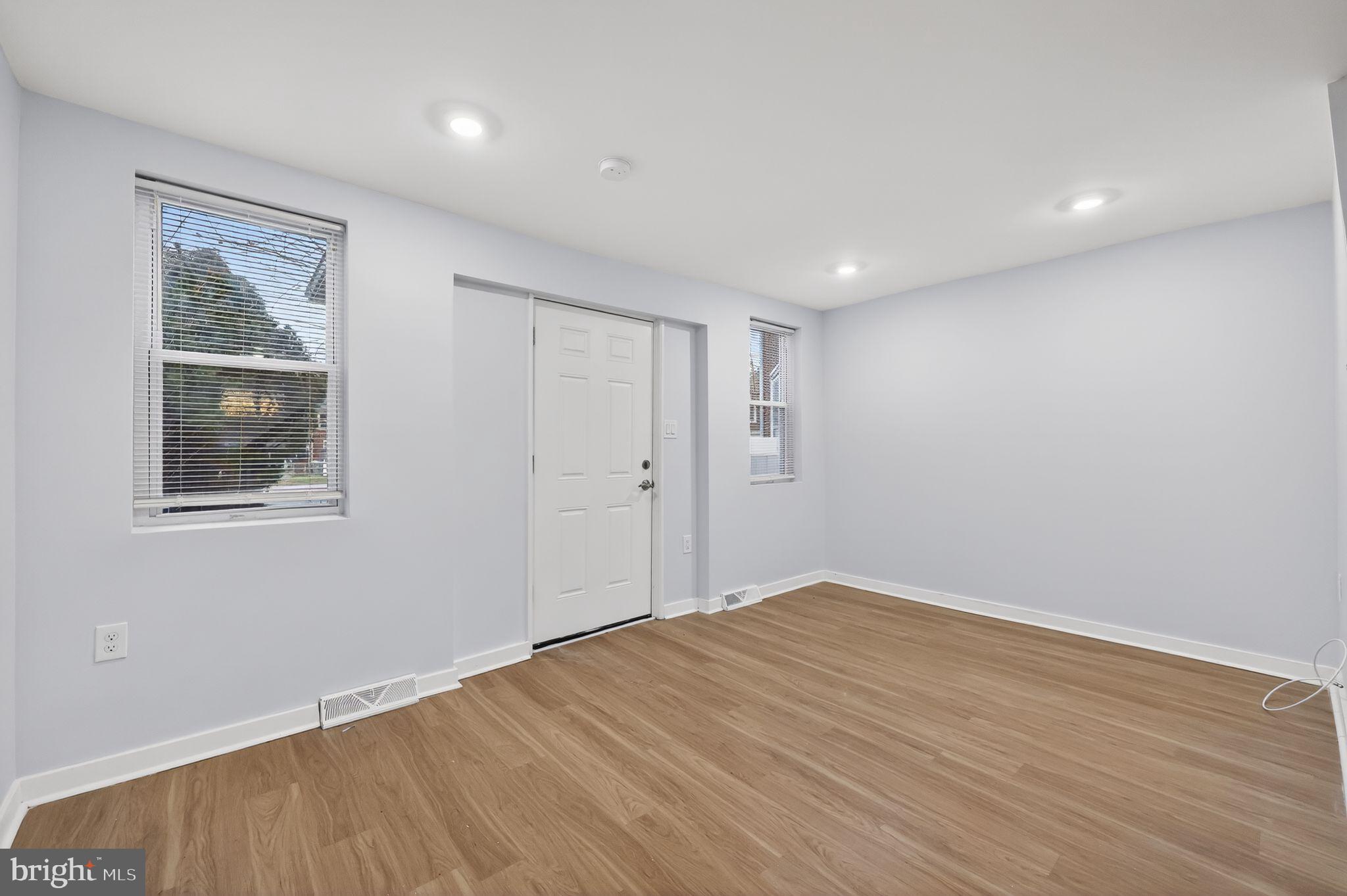 3055 Kearsarge Road Camden, NJ 08104 - Photo 2 of 26 a view of empty room with wooden floor and fan