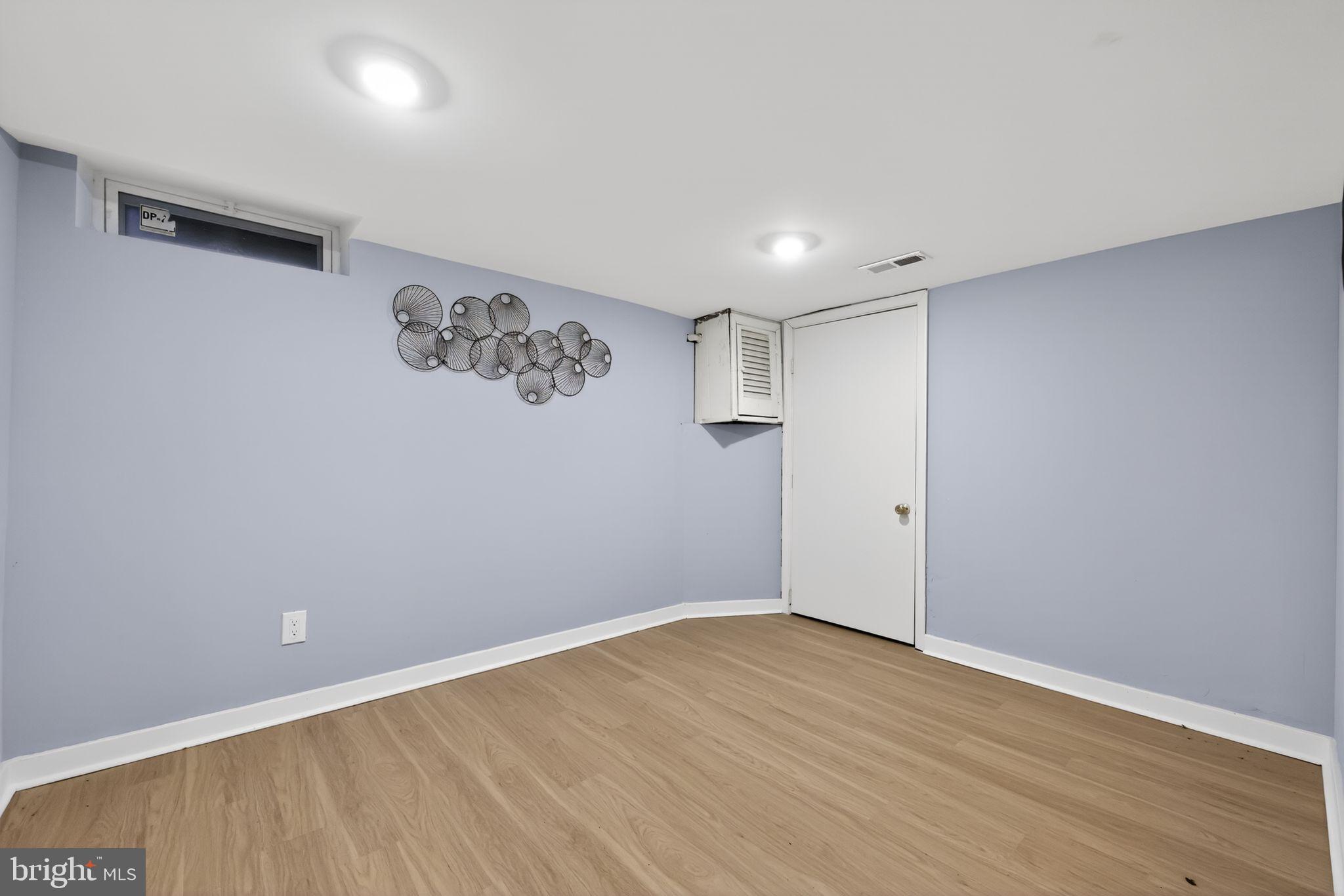 3055 Kearsarge Road Camden, NJ 08104 - Photo 22 of 26 a view of an empty room with wooden floor