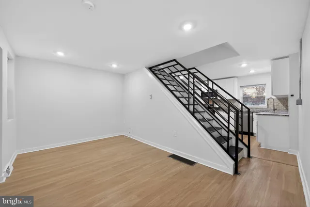 an entryway in a hall with stairs