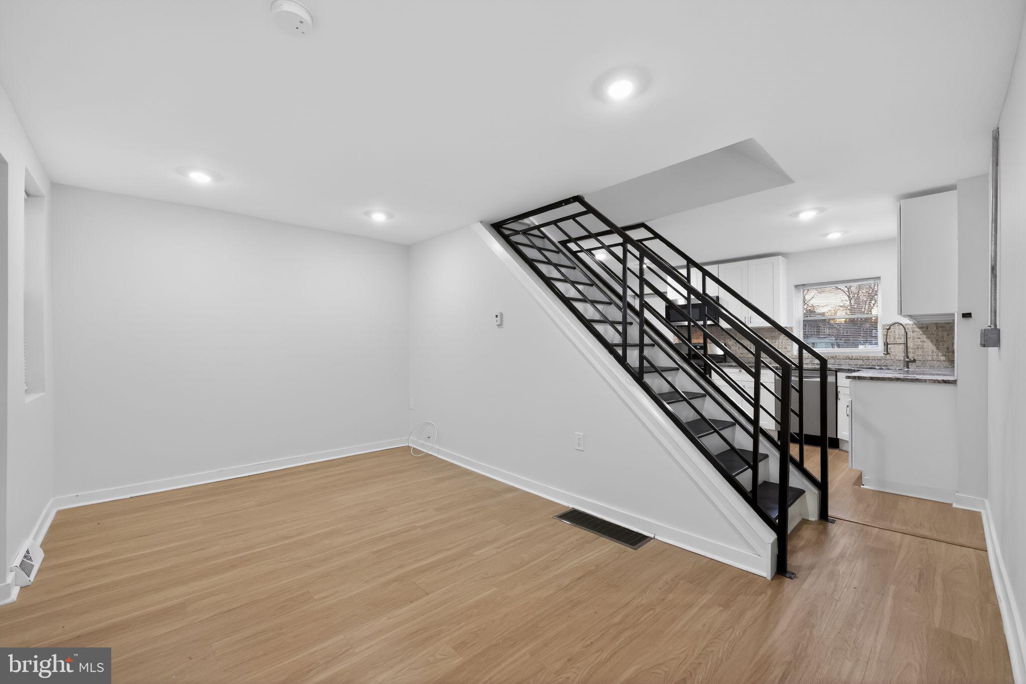 3055 Kearsarge Road Camden, NJ 08104 - Photo 4 of 26 an entryway in a hall with stairs