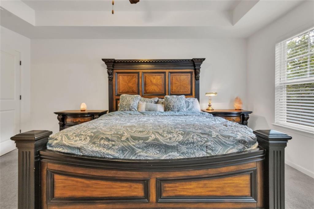 1563 Butternut Cove Stone Mountain, GA 30083 - Photo 18 of 35 a bedroom with a bed and a window