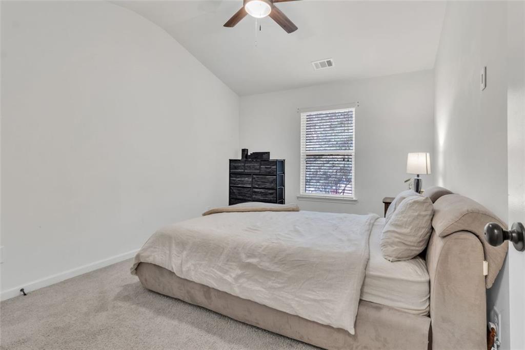 1563 Butternut Cove Stone Mountain, GA 30083 - Photo 22 of 35 a bedroom with a bed and a window