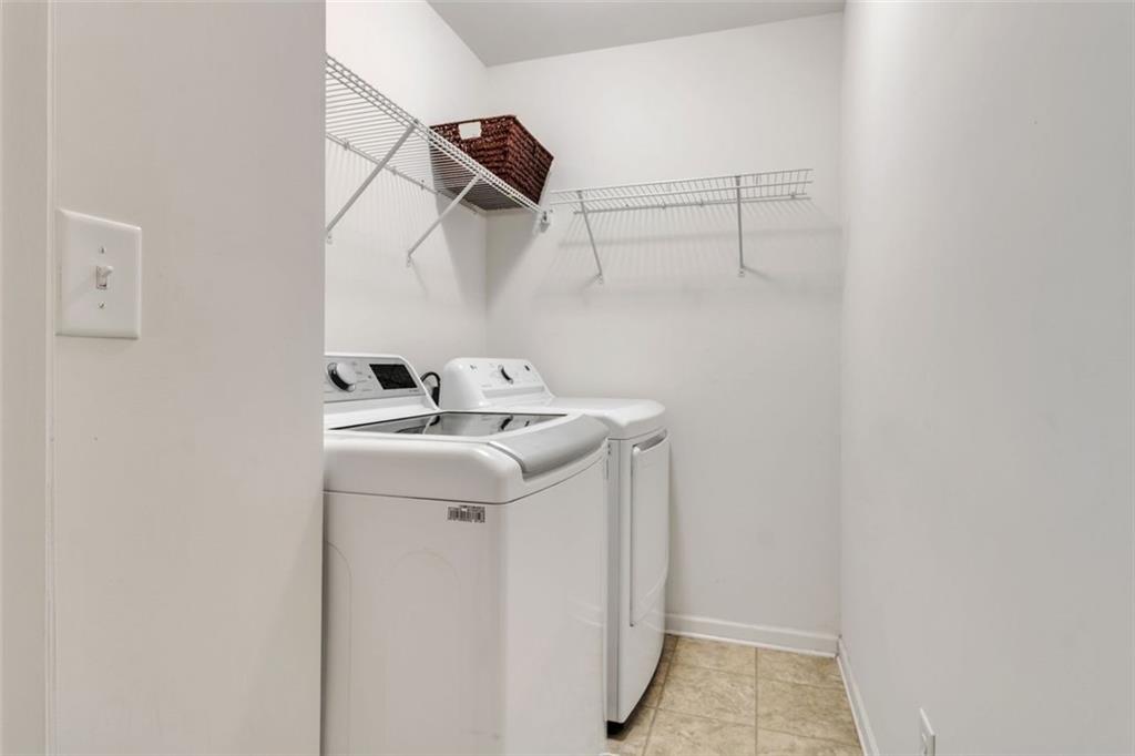 1563 Butternut Cove Stone Mountain, GA 30083 - Photo 26 of 35 a utility room with dryer and washer
