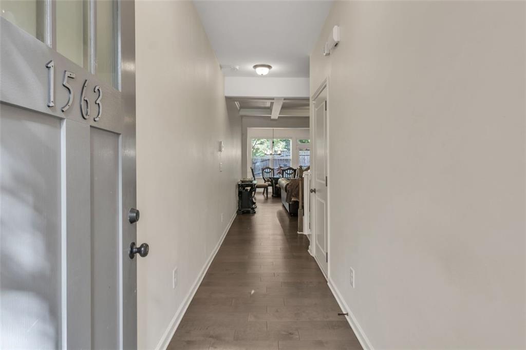 1563 Butternut Cove Stone Mountain, GA 30083 - Photo 4 of 35 a view of a hallway with a livingroom and a window