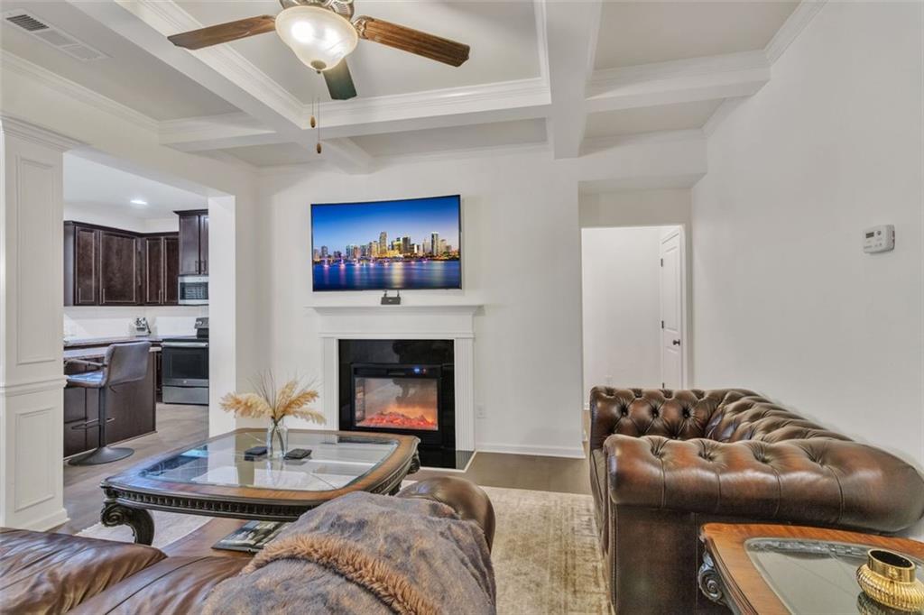1563 Butternut Cove Stone Mountain, GA 30083 - Photo 5 of 35 a living room with furniture and a fireplace