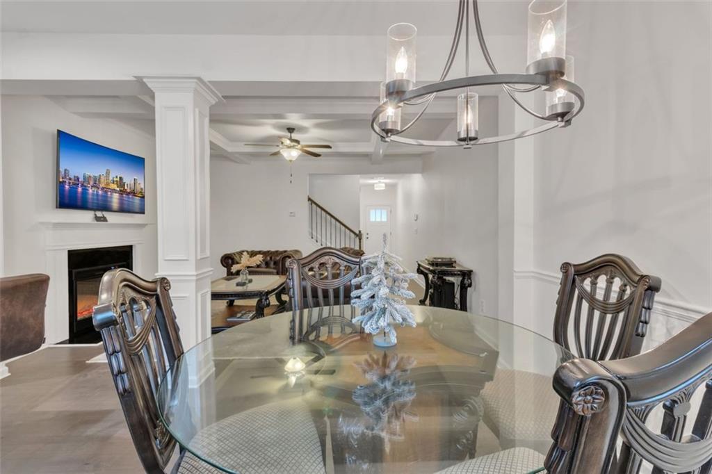 1563 Butternut Cove Stone Mountain, GA 30083 - Photo 7 of 35 a dining room with furniture and a chandelier