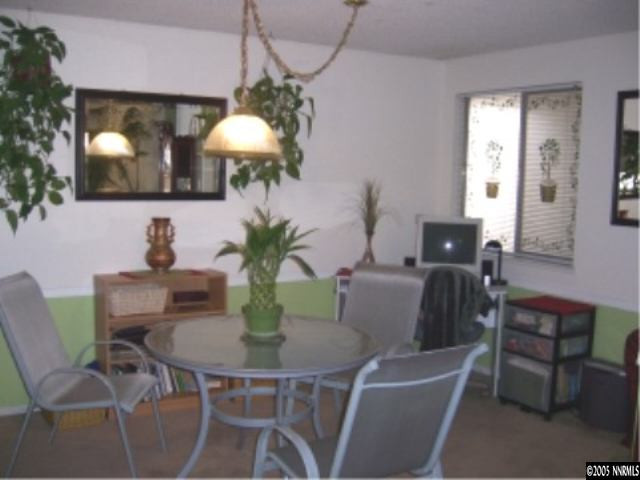 2811 Chavez Drive Reno, NV 89502 - Photo 4 of 6 a dining room with furniture and chandelier