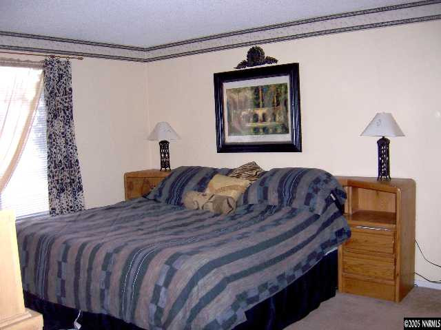 2811 Chavez Drive Reno, NV 89502 - Photo 6 of 6 a bedroom with a bed and a window