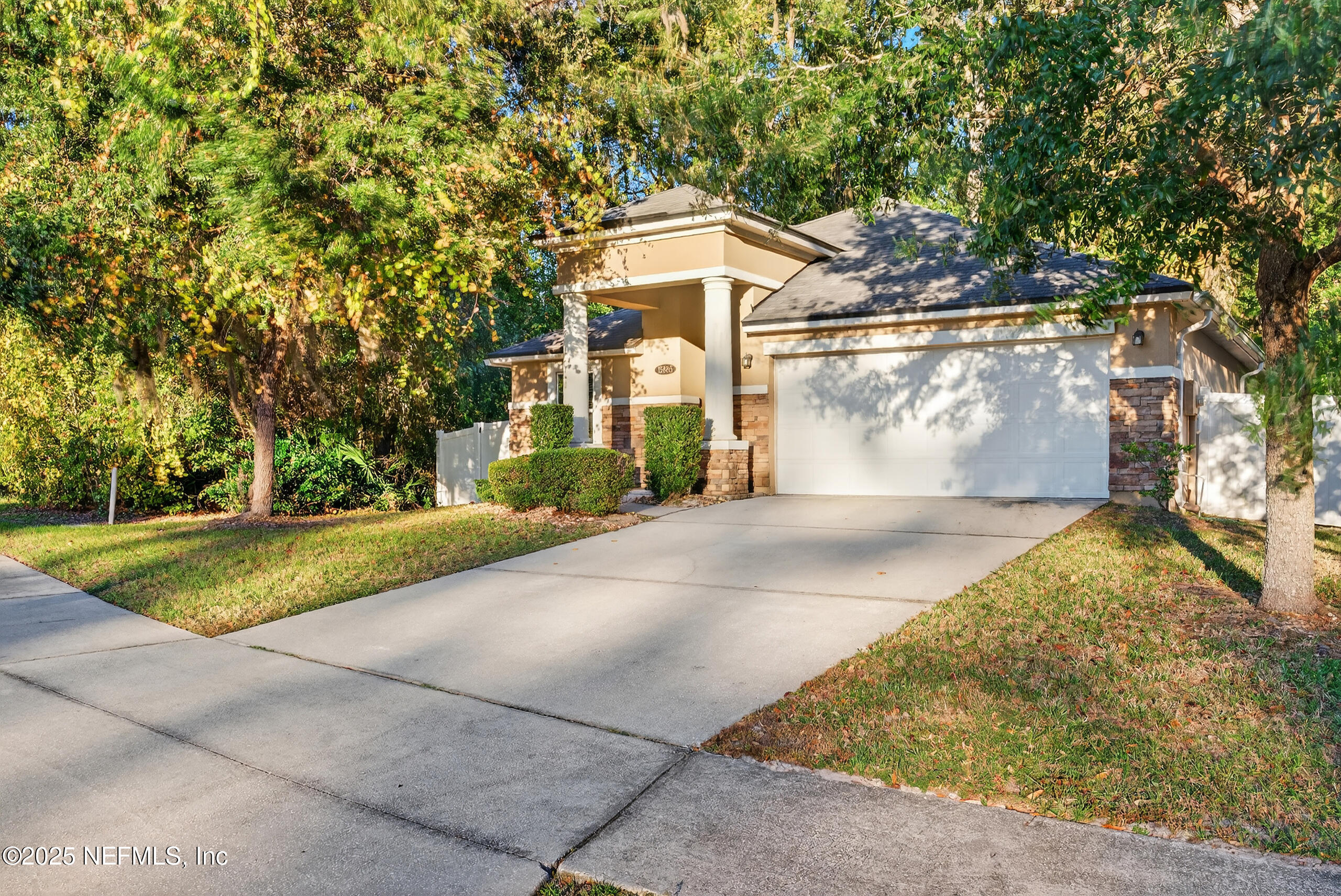 15885 Bainebridge Drive Jacksonville, FL 32218 - Photo 1 of 46 a front view of a house with a yard and garage