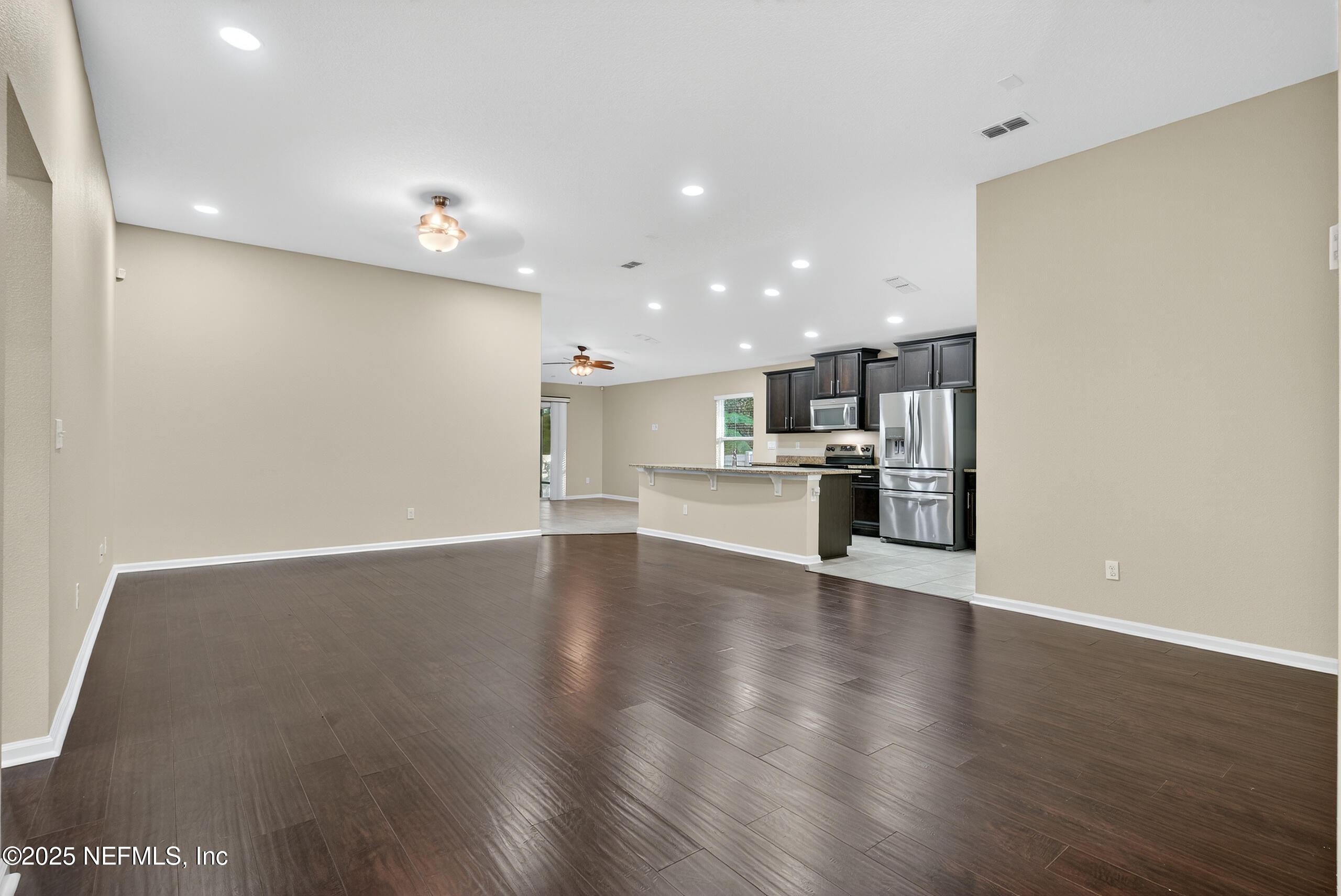 15885 Bainebridge Drive Jacksonville, FL 32218 - Photo 15 of 46 a view of kitchen with wooden floor and windows