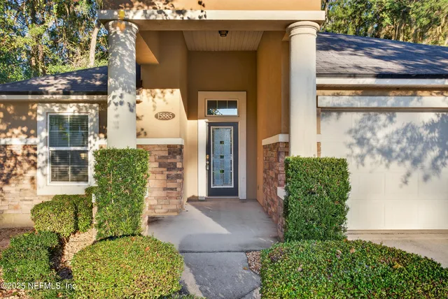 a front view of a house with garden