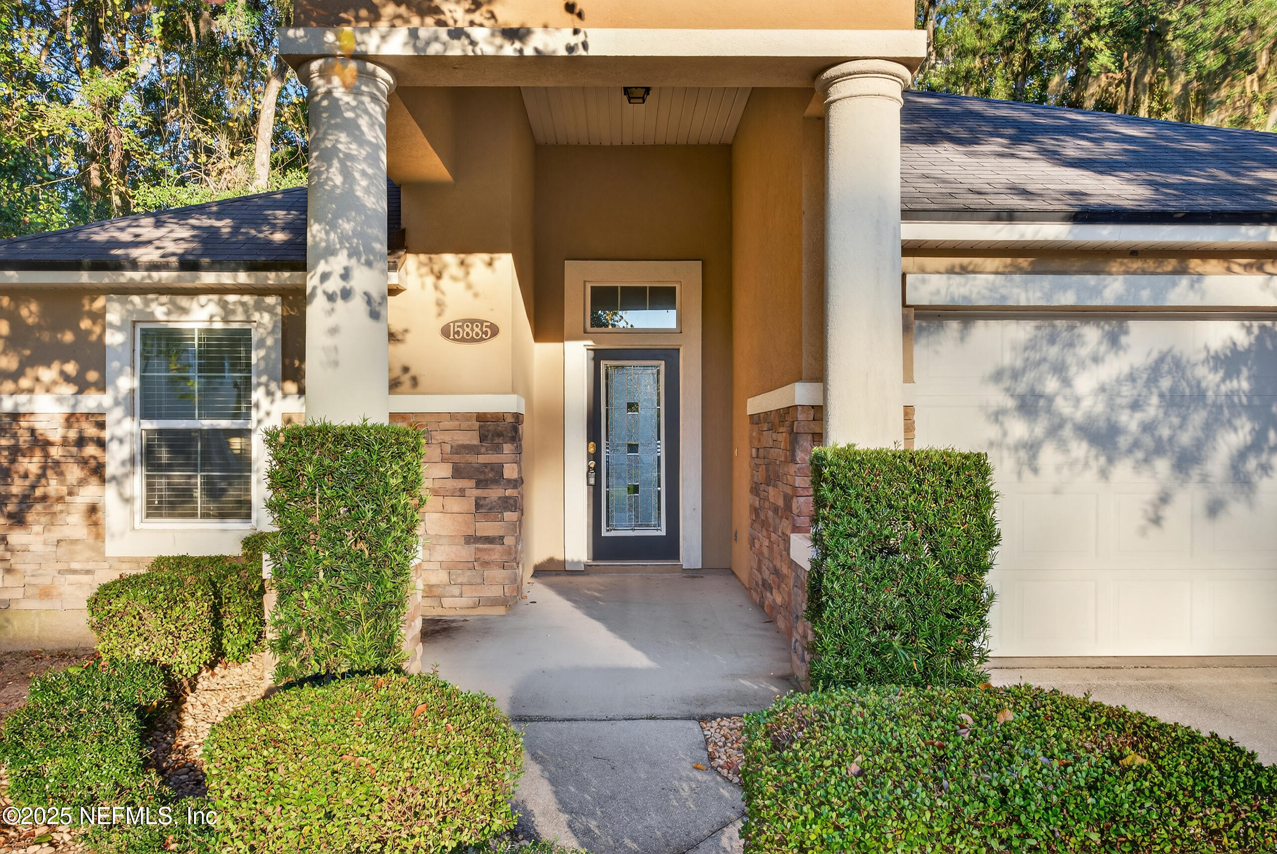 15885 Bainebridge Drive Jacksonville, FL 32218 - Photo 2 of 46 a front view of a house with garden