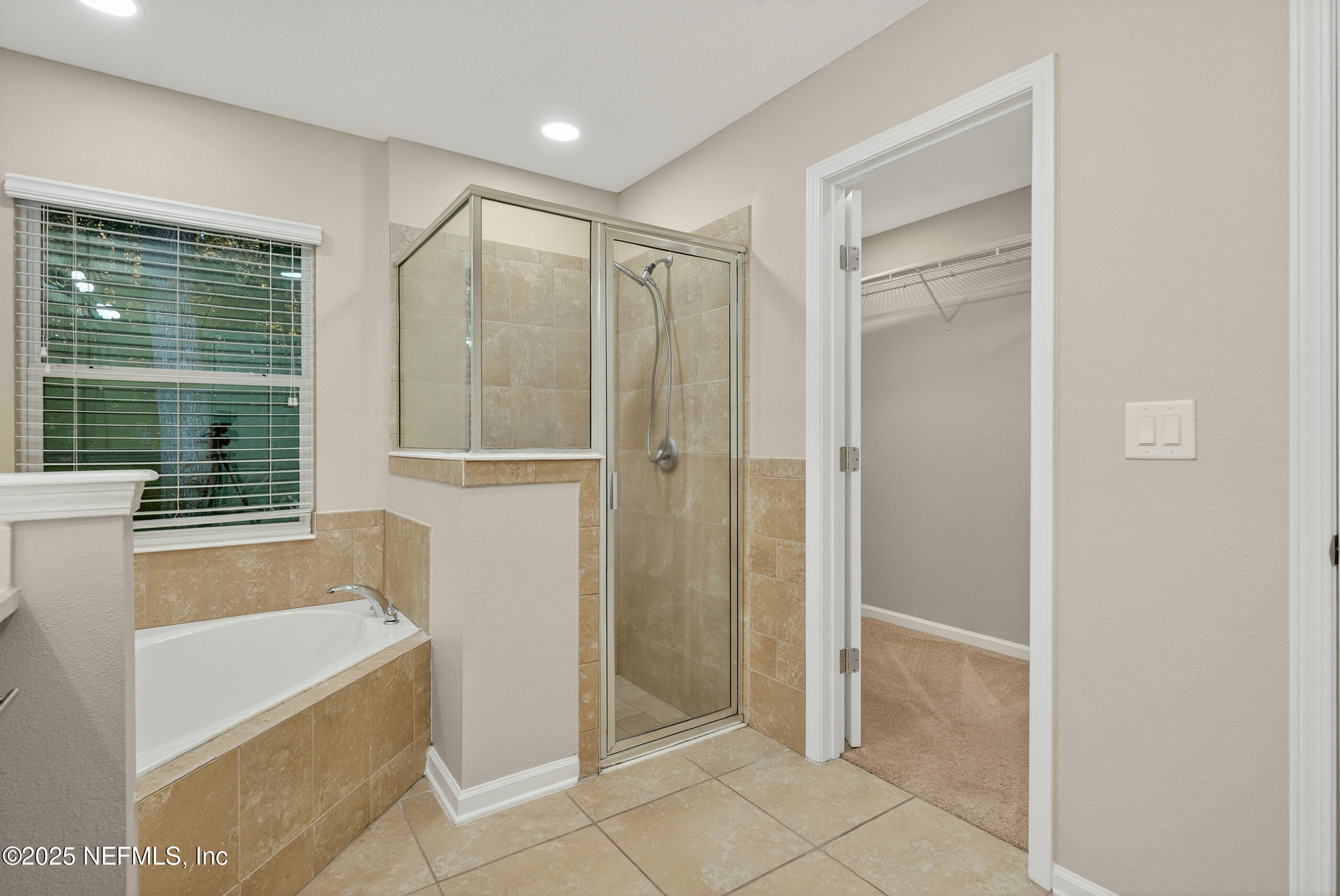 15885 Bainebridge Drive Jacksonville, FL 32218 - Photo 25 of 46 a bathroom with a bathtub and a shower
