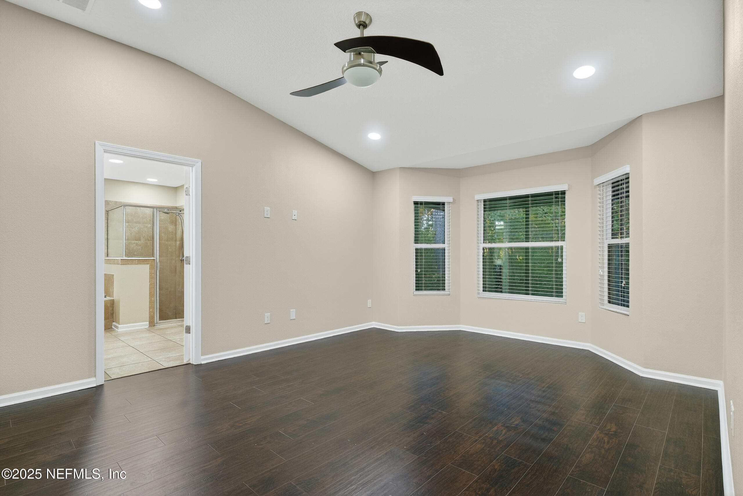 15885 Bainebridge Drive Jacksonville, FL 32218 - Photo 26 of 46 a view of an empty room with glass door and windows