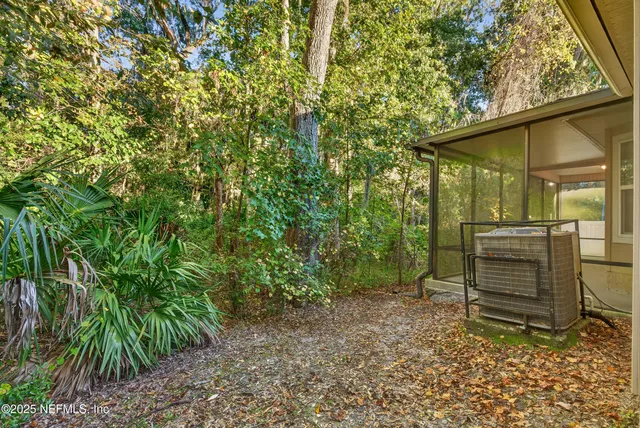 a backyard of a house with barbeque oven