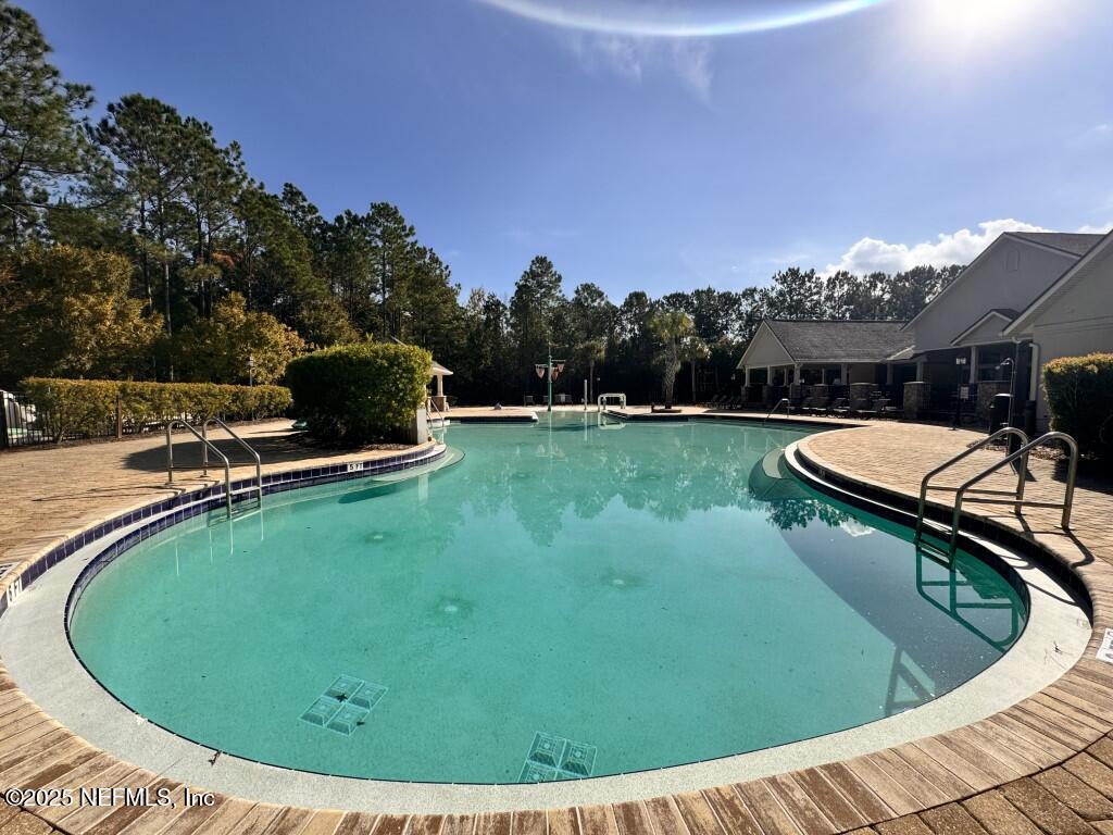 15885 Bainebridge Drive Jacksonville, FL 32218 - Photo 39 of 46 a view of a swimming pool with a yard